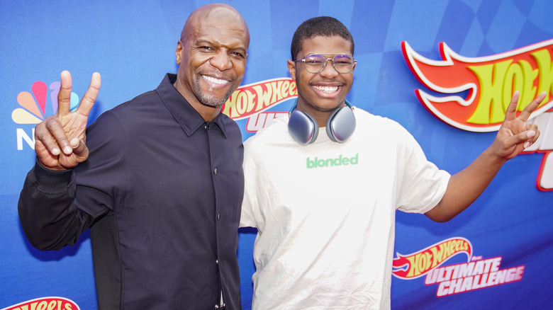 Terry Crews and Isaiah Crews posing