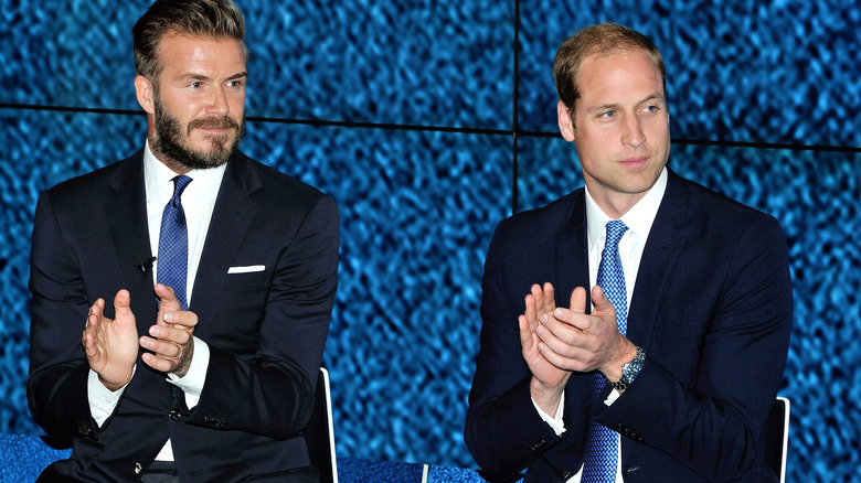 David Beckham and Prince William clapping at an event