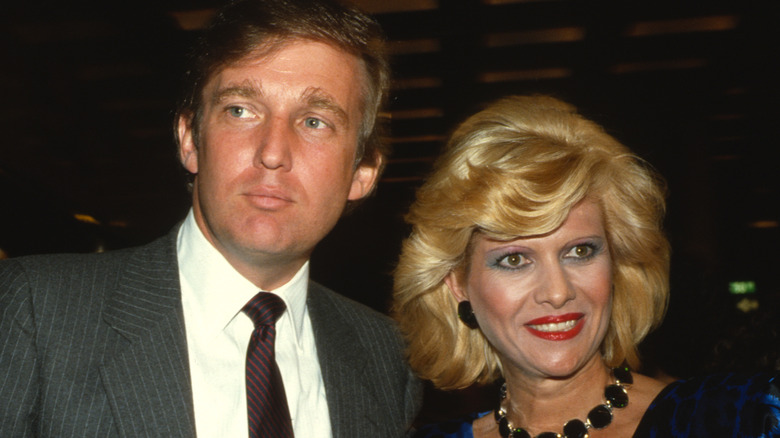 Donald Trump looks on, Ivana Trump smiles tensely