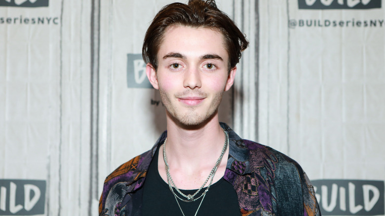 Greyson Chance in silver necklaces