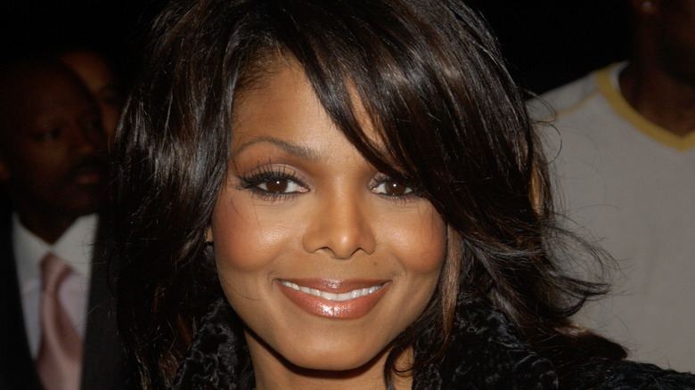 Janet Jackson with side swept bangs