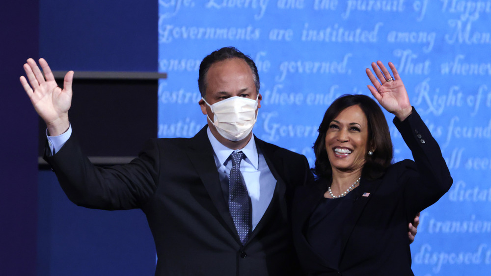 Doug Emhoff and Kamala Harris waving