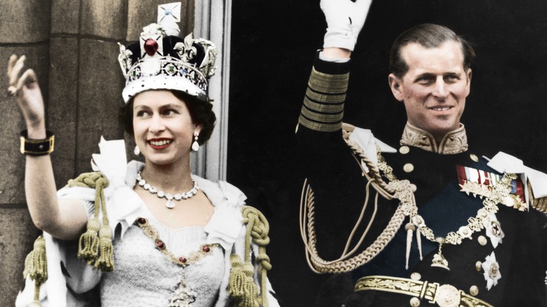 Queen Elizabeth II and Prince Philip waving at her coronation