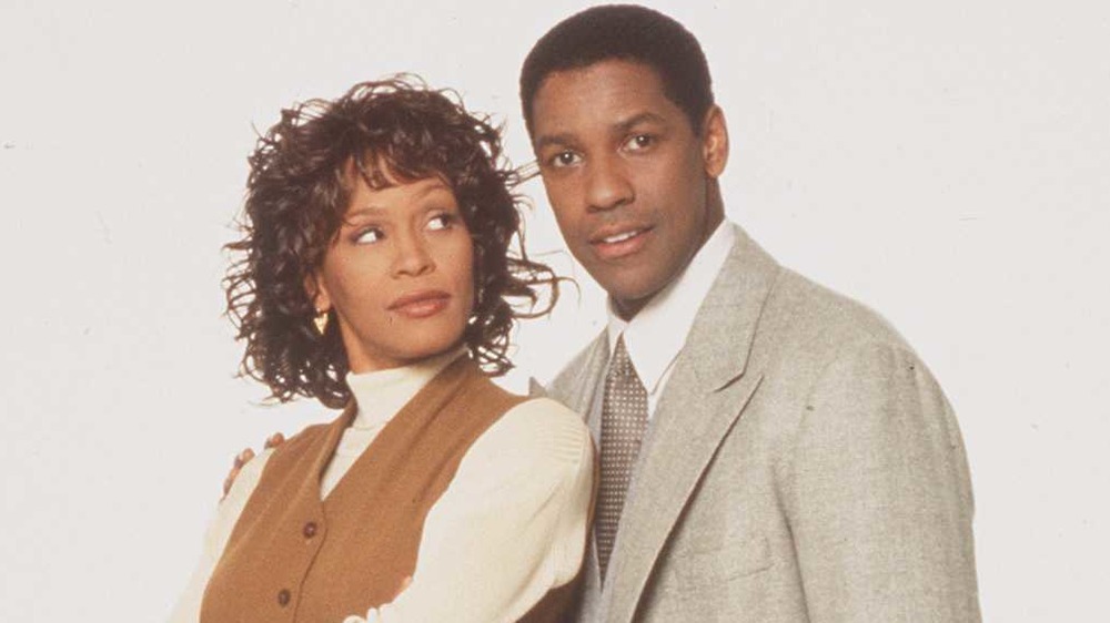 Whitney Houston looking at Denzel Washington