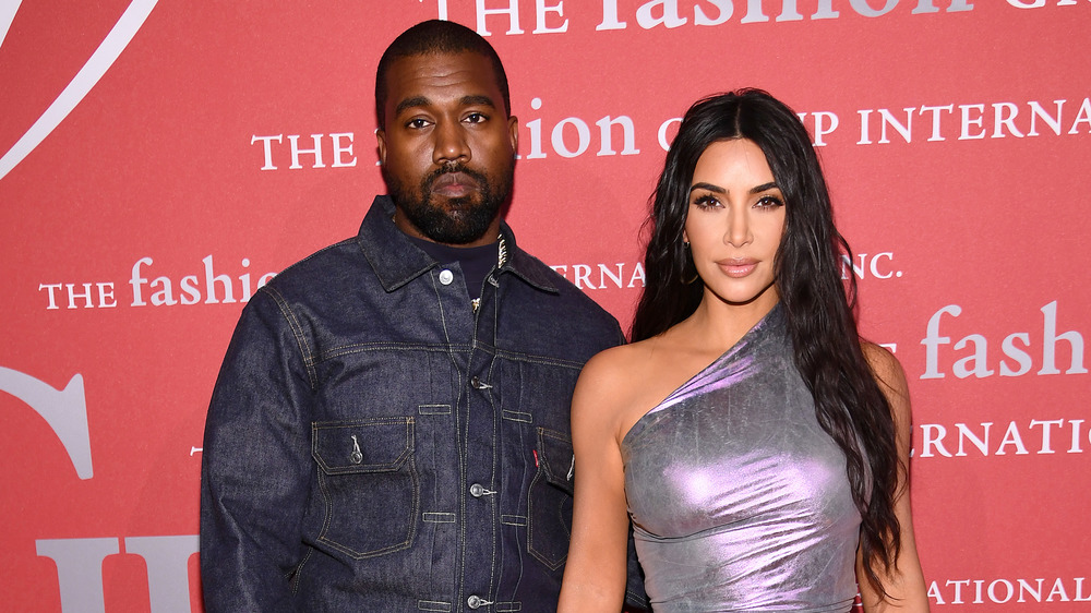 Kanye West and Kim Kardashian pose on the red carpet