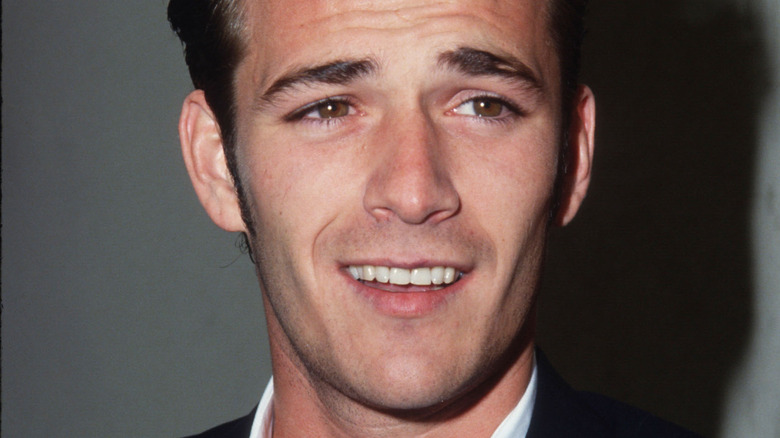 Luke Perry smiling in the '90s