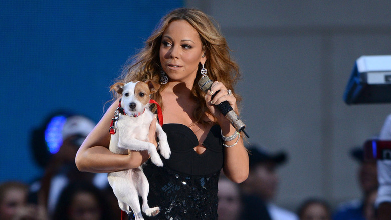 Mariah Carey performs holding her dog at Rockefeller Center