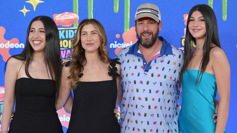 Sadie and Sunny Sandler posing at awards with their parents