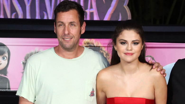 Adam Sandler and Selena Gomez smiling