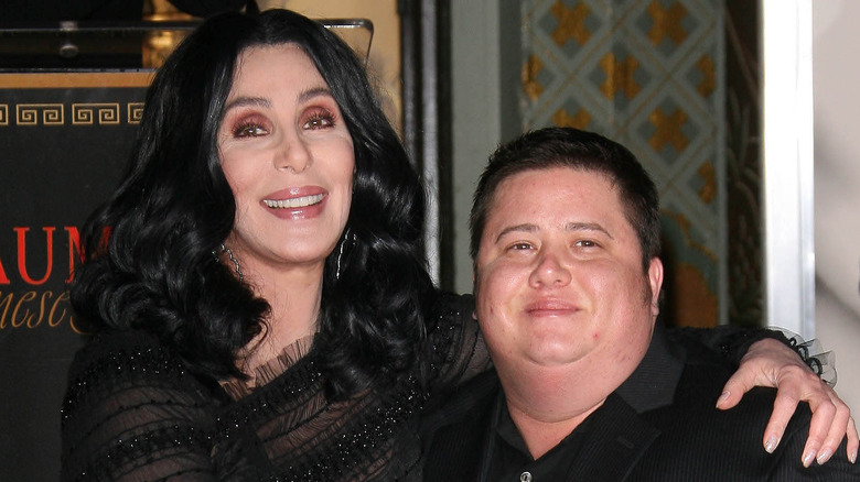 Cher and Chaz Bono, posing