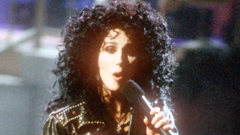 Cher big hair and mic