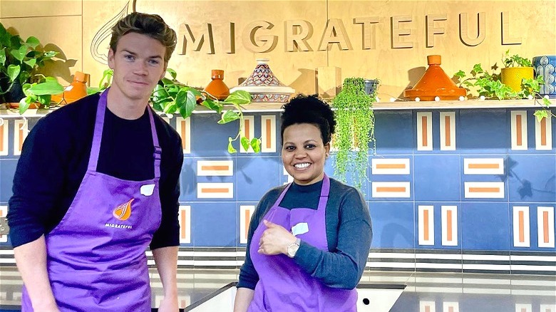 Will Poulter posing for Migrateful charity