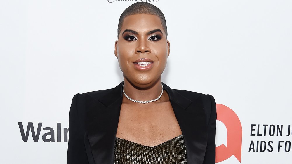 EJ Johnson in choker necklace and black blazer