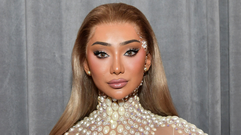 Nikita Dragun glammed up and posing for camera