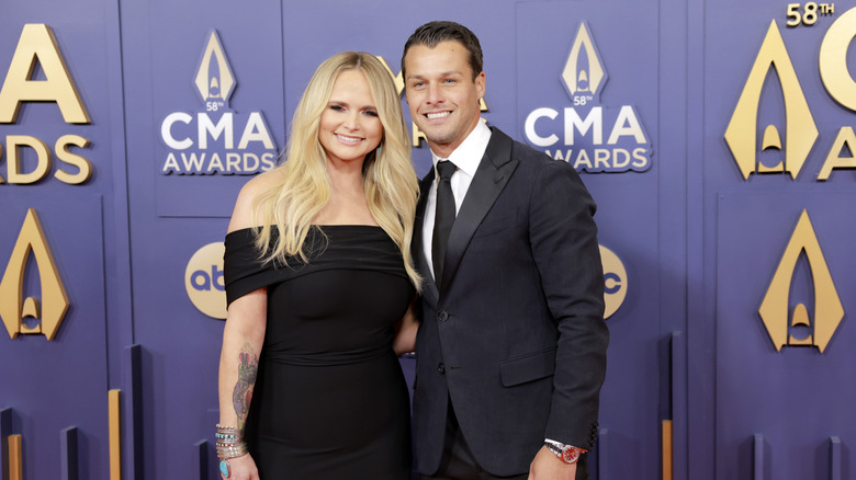 Miranda Lambert and Brendan McLoughlin with arms around each other at the CMAs