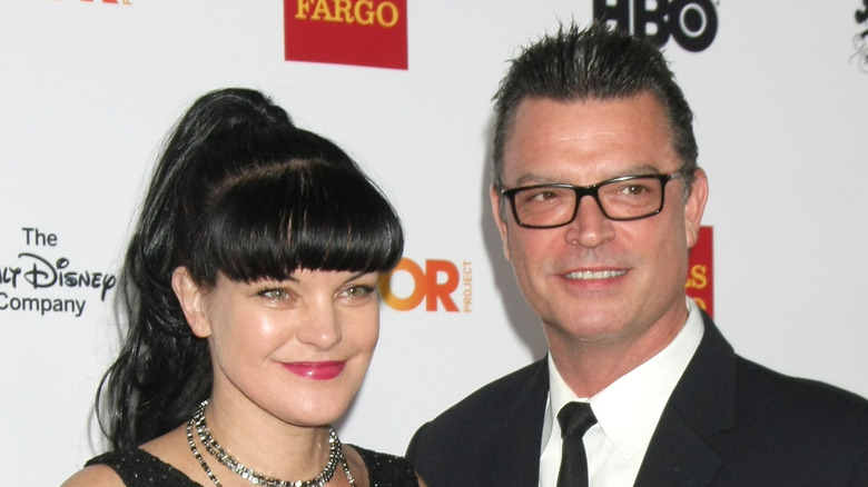 Pauley Perrette and Thomas Arklie smile on red carpet