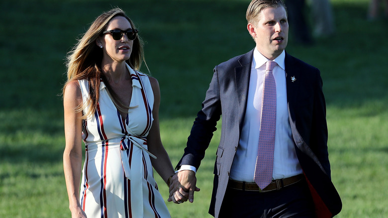 Eric and Lara Trump hold hands