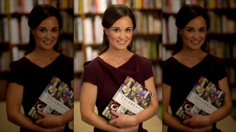 Pippa holding her book