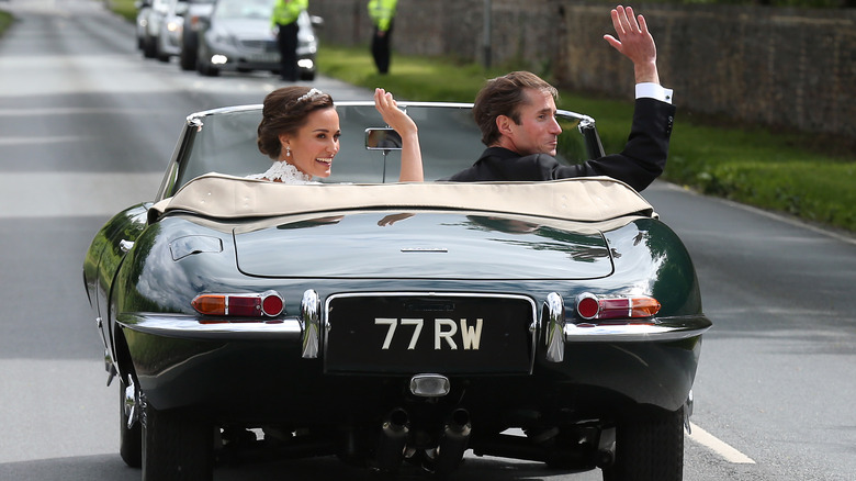 Pippa and James leaving St Mark's Church in a classic car