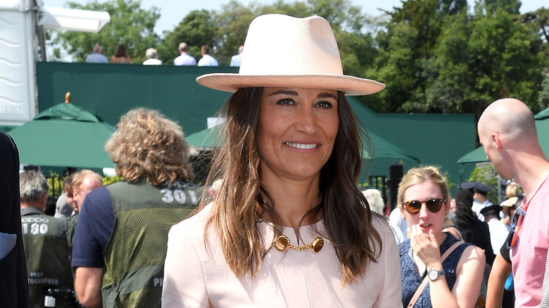 Pippa wearing a fedora outdoors