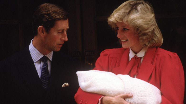 Prince Charles and Princess Diana with baby Prince Harry