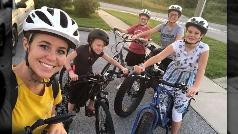 Jana Duggar with younger siblings riding bikes