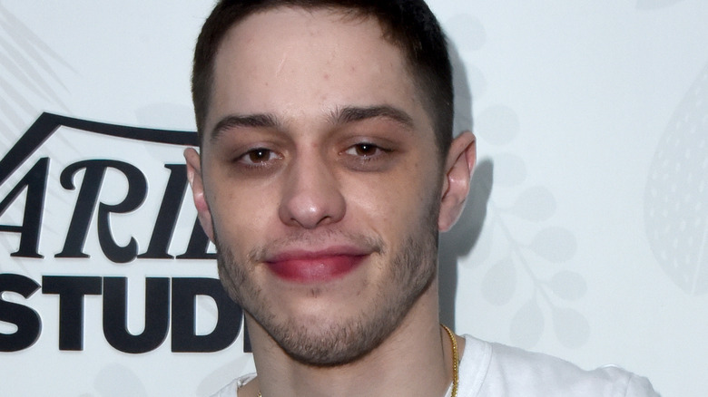 Pete Davidson with slight smile at event