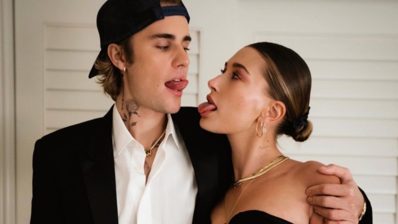 Justin Bieber and Hailey Baldwin sticking out their tongues 