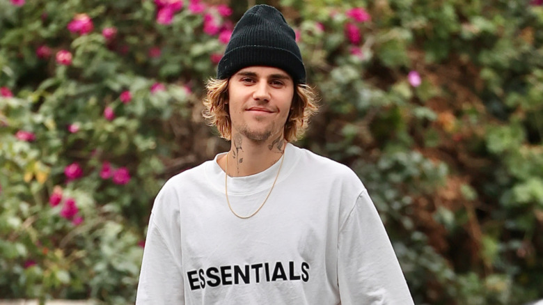 Justin Bieber smiling while walking around Los Angeles