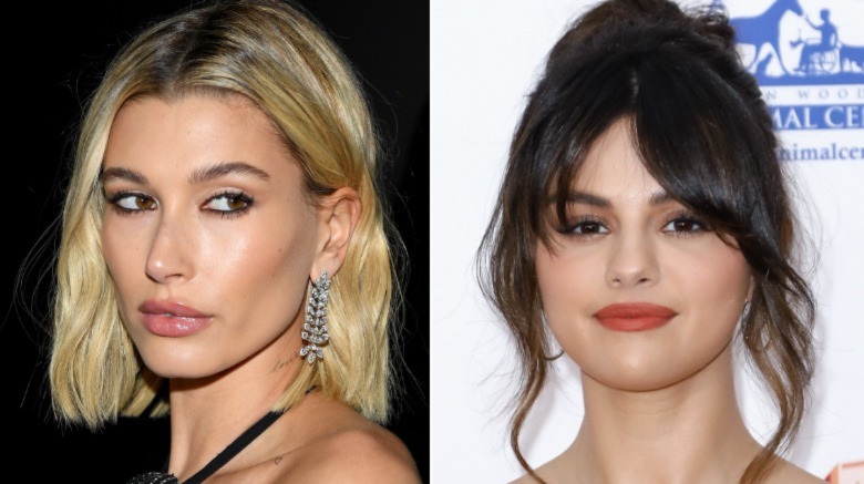 Hailey Baldwin looking to the side (left), Selena Gomez smiling (right)