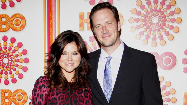 Tiffani Thiessen and Brady Smith smiling