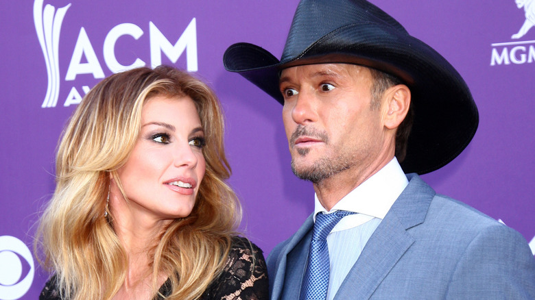 Faith Hill gazes at Tim McGraw on the red carpet