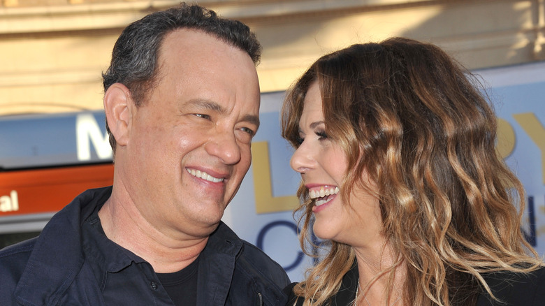 Tom Hanks and Rita Wilson smiling at each other