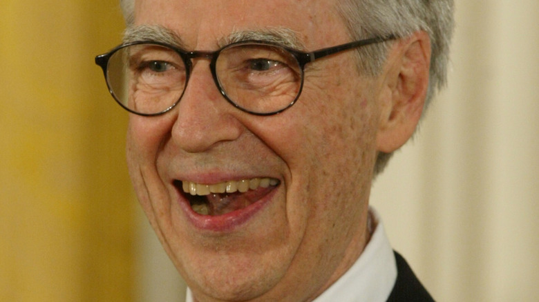 Fred Rogers smiles at an event