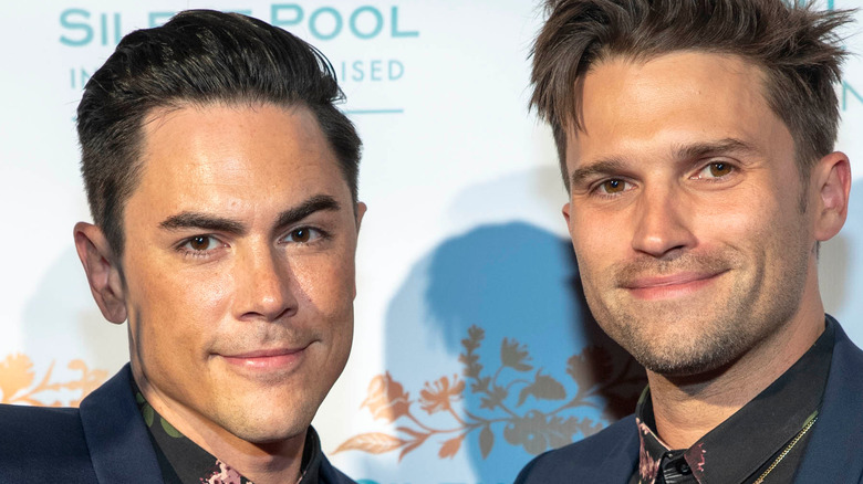 Tom Sandoval  Tom Schwartz smiling matching shirts