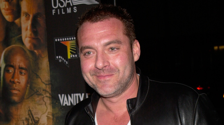 Tom Sizemore with a half-smile