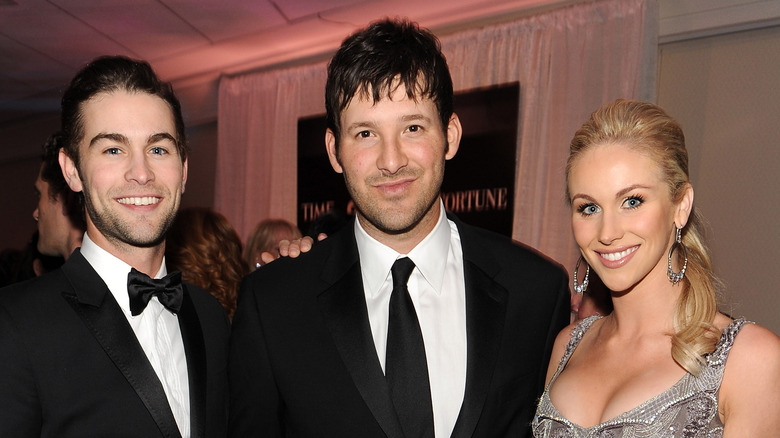 Chace Crawford, Tony Romo, and Candice Romo at an event