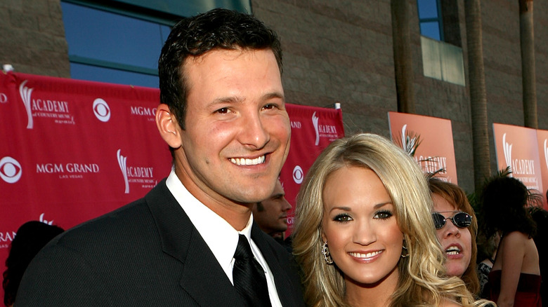 Tony Romo and Carrie Underwood at an event