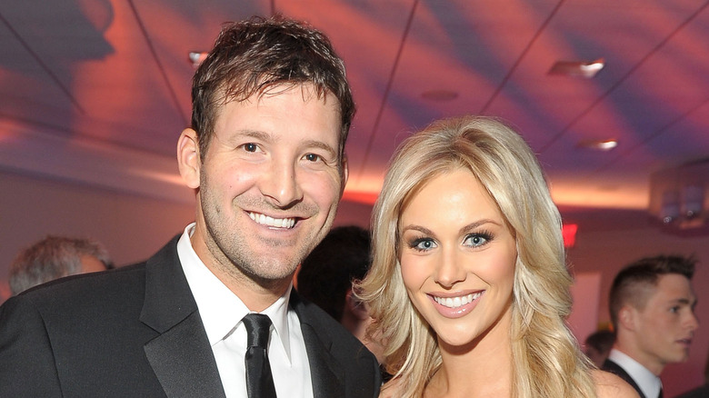 Tony Romo and Candice Romo at an event