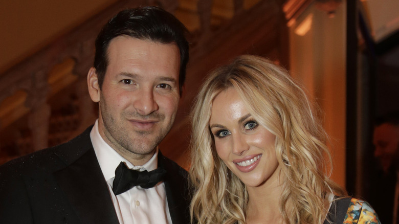 Tony Romo and Candice Romo at an event