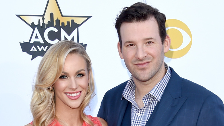 Tony Romo and Candice Romo at an event