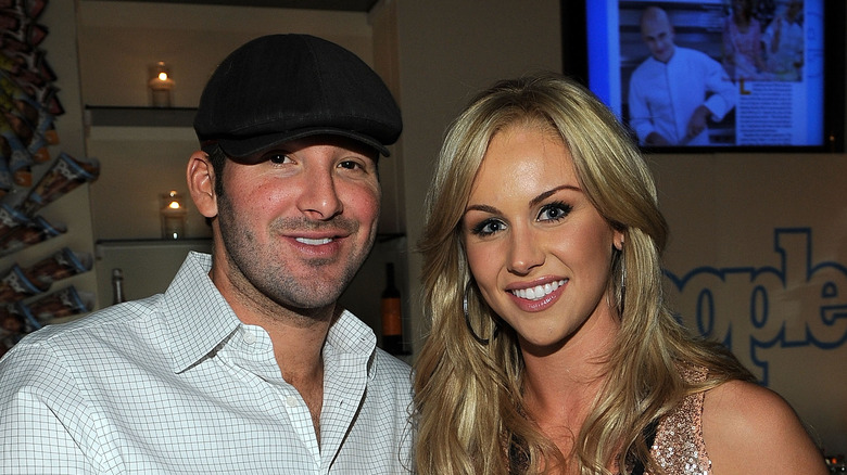 Tony Romo and Candice at an event