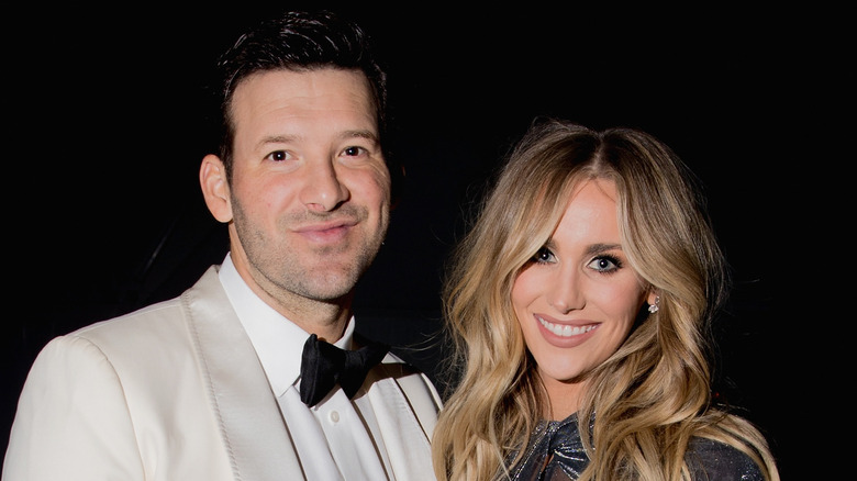 Tony Romo and Candice Romo at an event