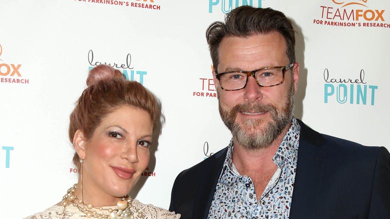 Tori Spelling and Dean McDermott pose together on the red carpet