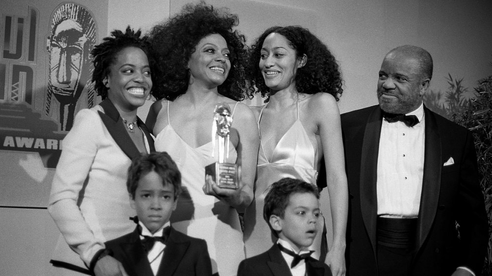 Black-and-white photo of Diana Ross with children Rhonda, Tracee, Ross, and Evan, plus record producer Berry Gordy, in 1995