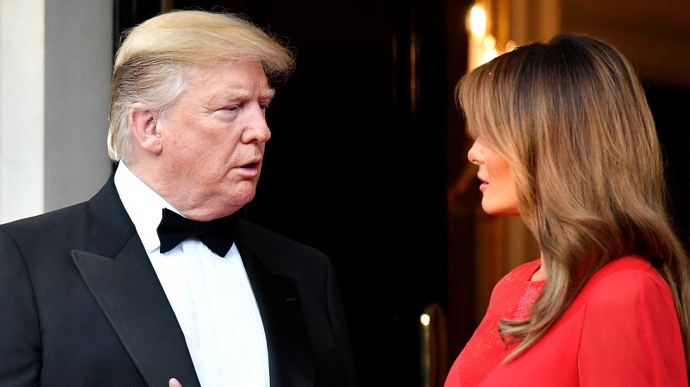 Donald and Melania Trump looking at one another