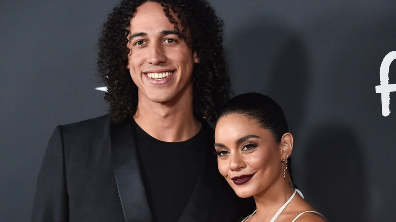 Cole Tucker and Vanessa Hudgens posing together