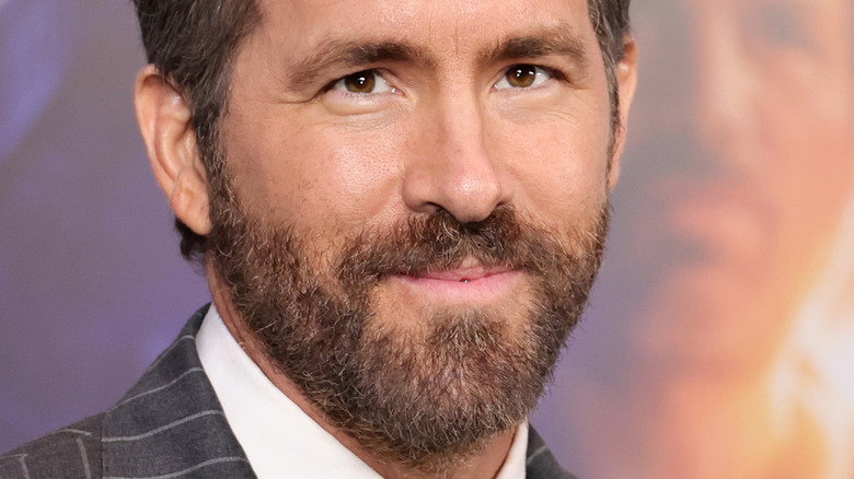 Ryan Reynolds with beard and brown eyes