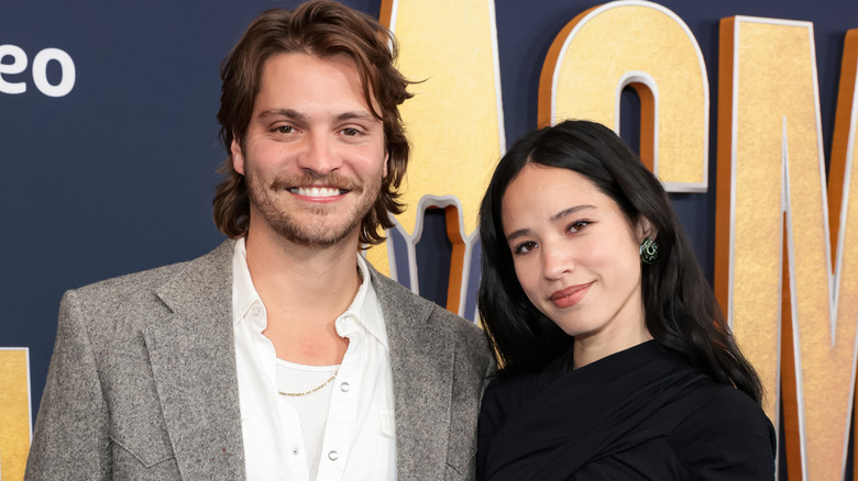 Luke Grimes and Kelsey Asbille posing