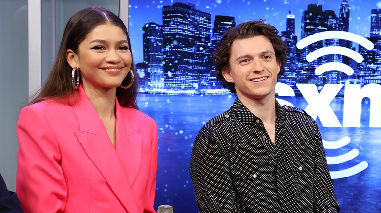 Zendaya and Tom Holland grinning